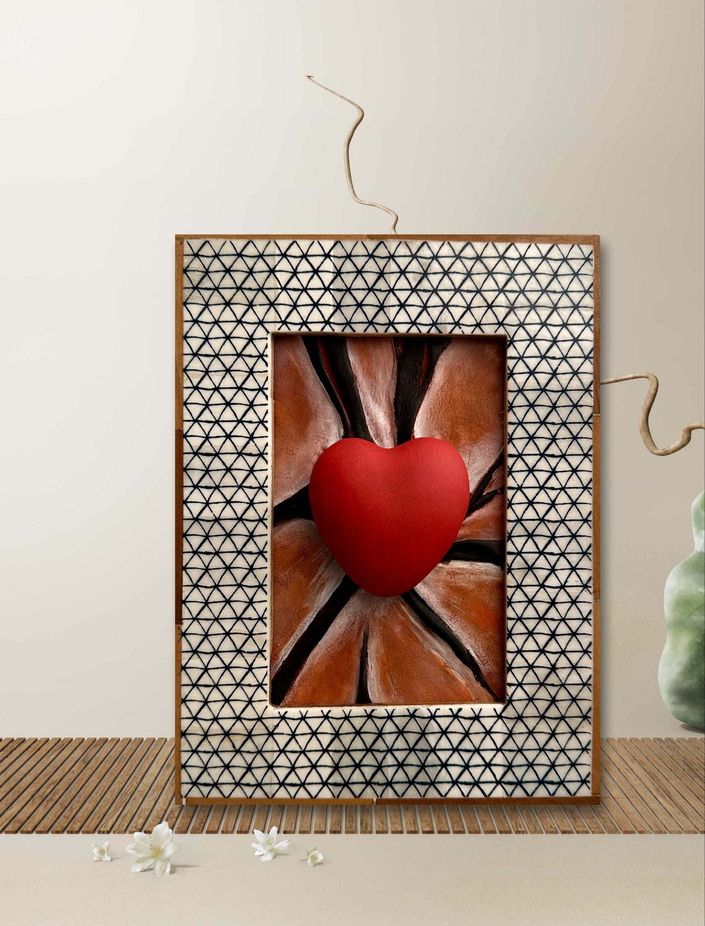 One-of-a-kind leather heart sculpture hand-painted in black lines for a sophisticated touch.
