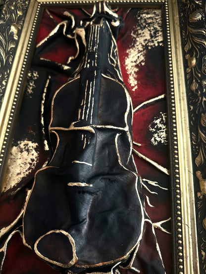 Handmade leather sculpture inspired by a violin