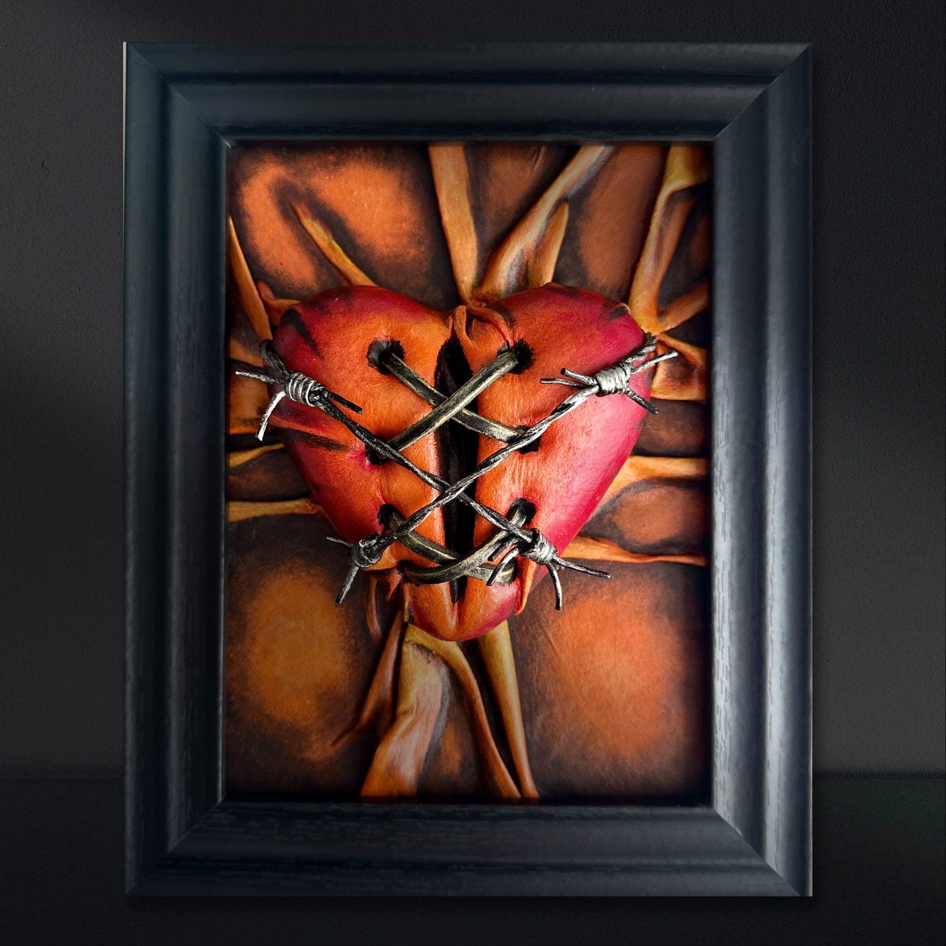 Eco-conscious vegan leather heart sculpture with a fusion of orange, bronze, and crimson hues, symbolizing love and connection.