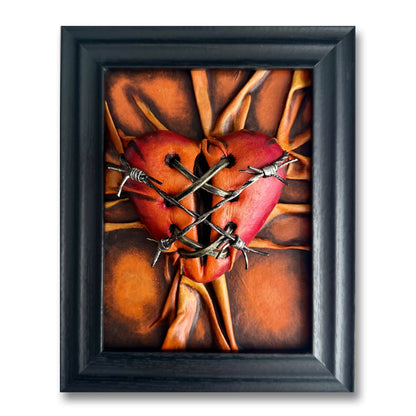 Vegan leather art sculpture shaped like a heart, featuring hues of orange, bronze, and crimson with black shadows.