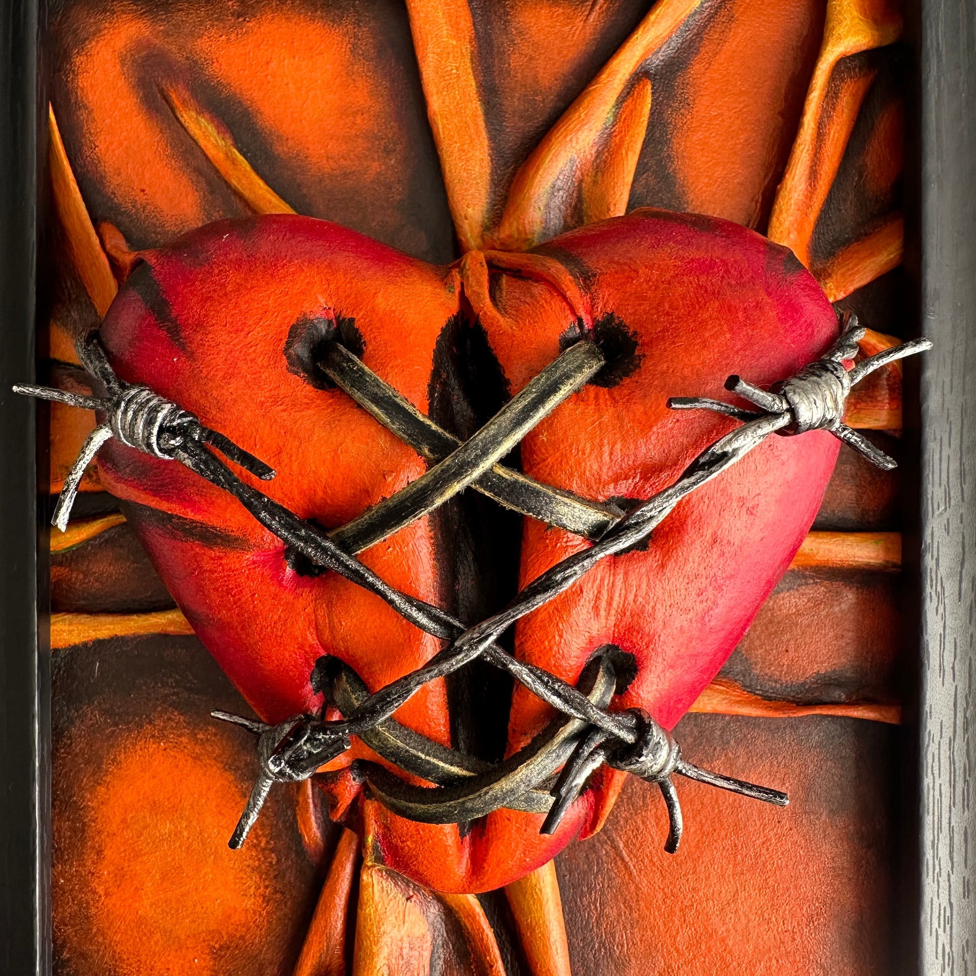 Handcrafted vegan leather heart art, painted in rich, warm tones, perfect for a romantic gift or special occasion.