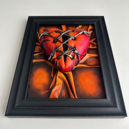 Vegan leather art piece shaped like a heart, painted with acrylics in a symphony of orange, bronze, and crimson tones.