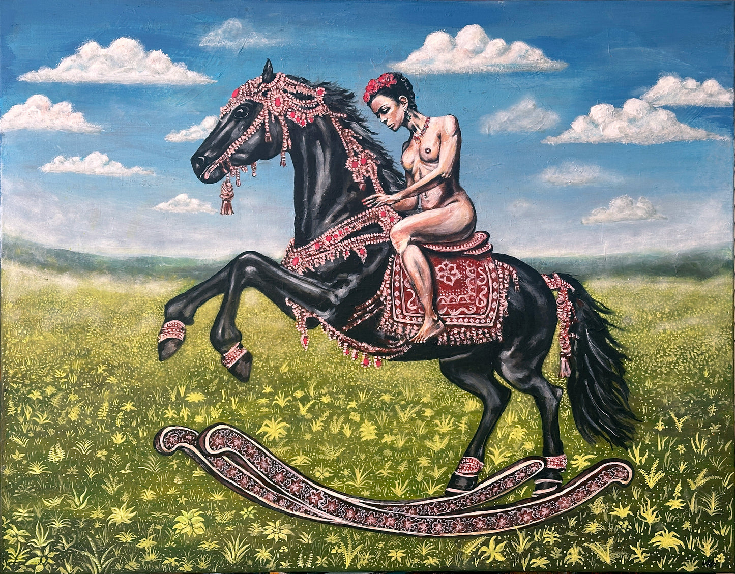 Woman riding a decorated horse in an open field with a blue sky.