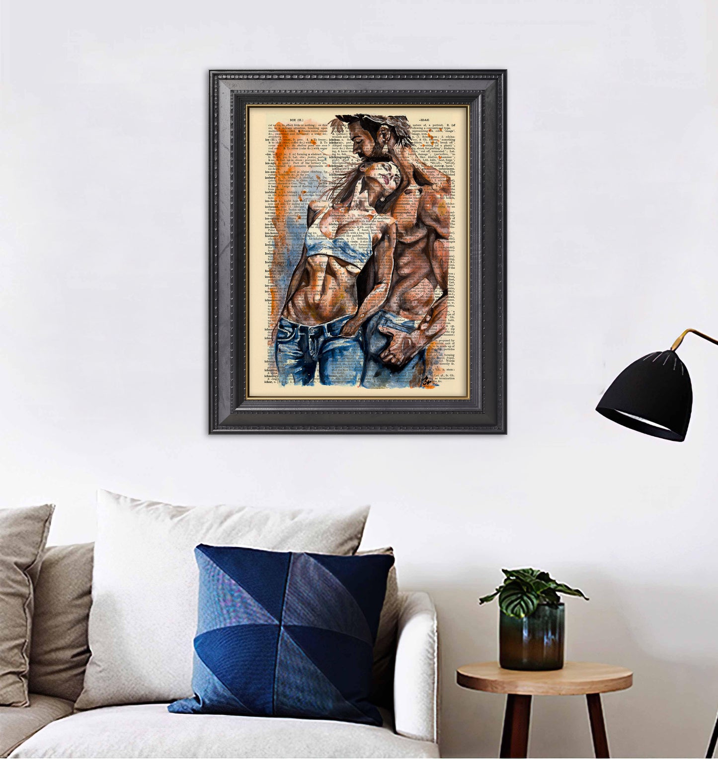 Romantic digital artwork of a couple in jeans, nestled close together, on an old dictionary page.