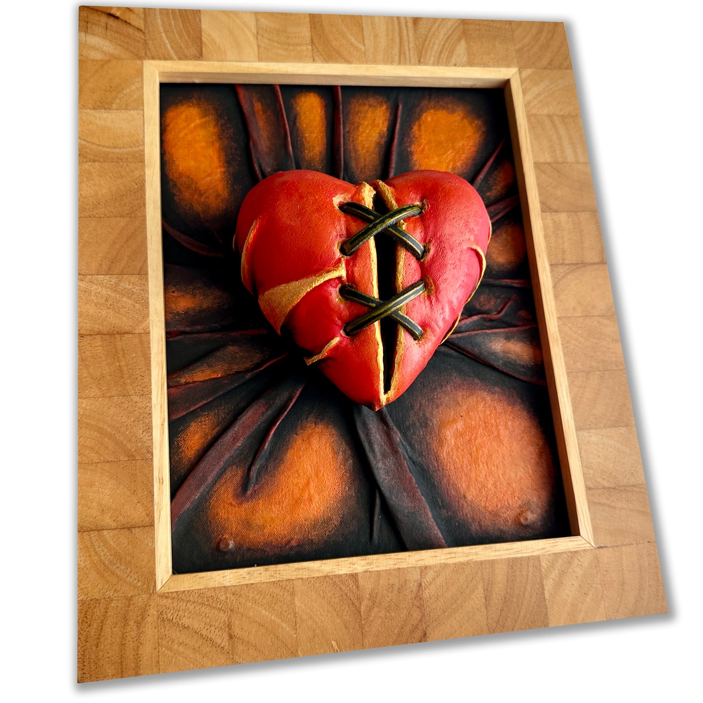 Hand-sculpted Broken Lovers Heart leather artwork with vibrant colors.