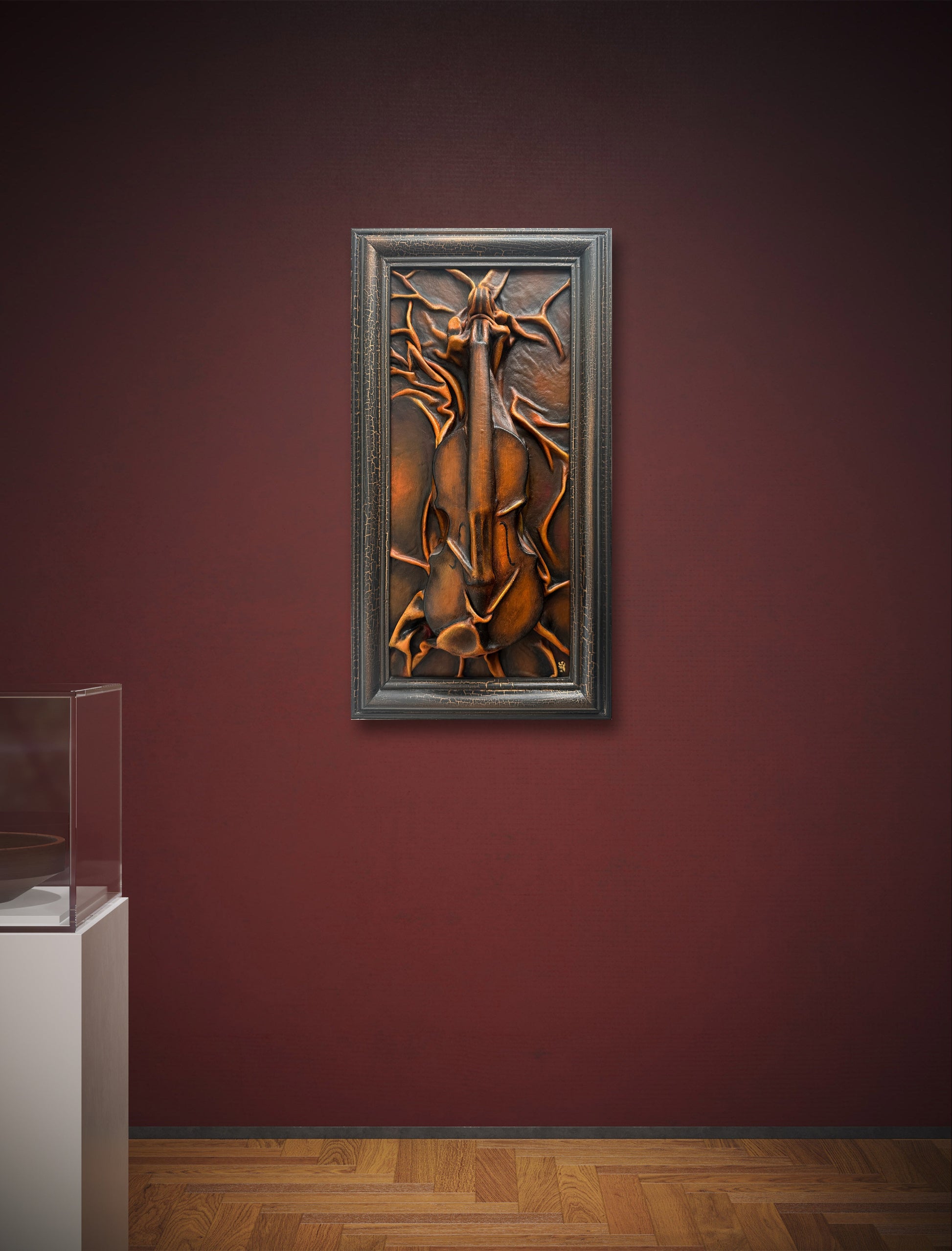 Violin themed leather sculpture framed in crackled gold