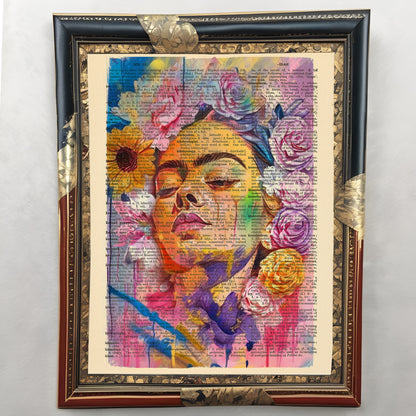 Vintage-style portrait of Frida Kahlo surrounded by flowers on an old book page.