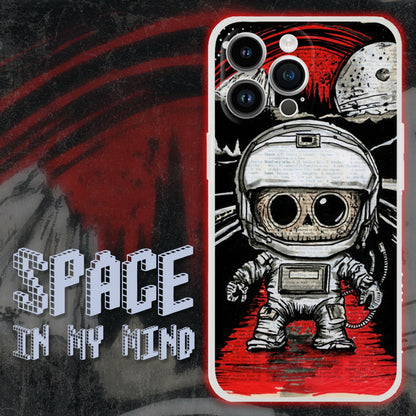 Space In My Mind iPhone Case is acrylic painting on a vintage dictionary page, show a astronaut with large black eyes and an oversized head. In the backdrop, a lunar landscape unfolds, two prominent planets just above the horizon and a crimson glow.